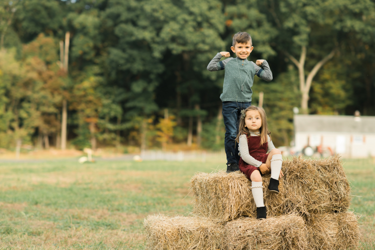 Fall is in full swing here in NJ, my first Fall Family session with Anna and Adam at their Farm House in Hackettstown NJ. Anna and Adam recently purchased their dream farm house on a 4 acres of land. This family of four now has chickens, ducks, birds, cats, a dog, sheep and plans to add many more to the list in the future. I had the honor of visiting Anna and Adam and their two beautiful children at their Farm the other day. I got much need vitamin D walking around the property, enjoying the foliage, running around with their kids and meeting all the farm animals. I sincerely enjoy photographing families now because there are no dull moments with kids, every moment is perfect! Fall family session at Anna and Adam’s Farm at Hackettstown NJ photographed by Karis from HeyKaris.